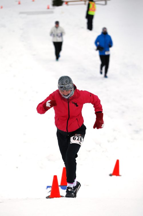 JOHN WOODS / WINNIPEG FREE PRESS
Julie Simpson climbs a river bank as she comes off the Red River as part in the 6th annual Frostbite River Run, a fundraiser in support of programming and activities at Riverview Community Centre in WinnipegSunday, January 27, 2019. The Frostbite River Run is part of the Riverview Winter Classic - a series of outdoor events held in January at the community centre.