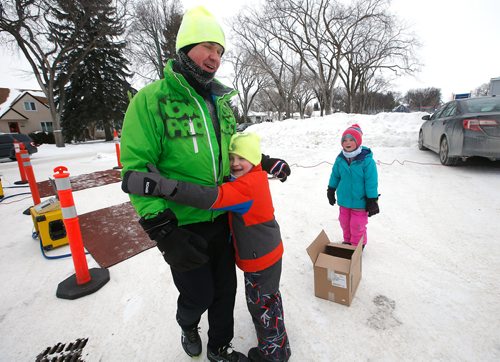 JOHN WOODS / WINNIPEG FREE PRESS
As as Noah Cunningham looks on Loic Shearer hugs his dad Dave as he finishes the 6th annual Frostbite River Run, a fundraiser in support of programming and activities at Riverview Community Centre in WinnipegSunday, January 27, 2019. The Frostbite River Run is part of the Riverview Winter Classic - a series of outdoor events held in January at the community centre.