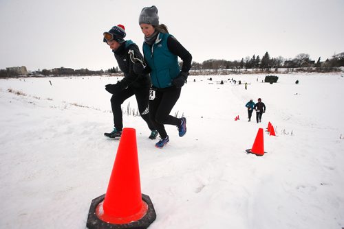 JOHN WOODS / WINNIPEG FREE PRESS
Lauren MacMillan, left, and Michelle MacMillan climb a river bank as they come off the Red River as part in the 6th annual Frostbite River Run, a fundraiser in support of programming and activities at Riverview Community Centre in WinnipegSunday, January 27, 2019. The Frostbite River Run is part of the Riverview Winter Classic - a series of outdoor events held in January at the community centre.