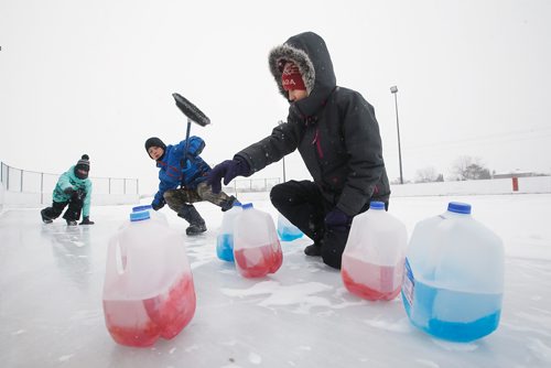 JOHN WOODS / WINNIPEG FREE PRESS
Piper Heinemann, from left, with her brother Lucas and her friend Nourah Kassat play some milk jug curling at the Whyte Ridge Community Centre's Winter Carnival in Winnipeg Sunday, January 27, 2019.