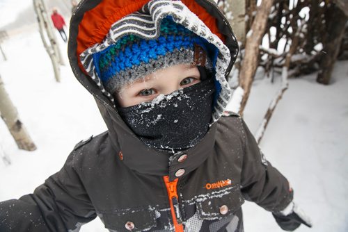 MIKE DEAL / WINNIPEG FREE PRESS
Jay, 3, is all bundled up during self-directed play outdoors Monday morning at the FortWhyte Alive Forest School. A pre-school alternative where kids ages 3-5 spend the whole session outdoors in the woods, even in this cold weather. They are hardier than most adults! 
190128 - Monday, January 28, 2019.