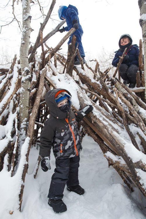 MIKE DEAL / WINNIPEG FREE PRESS
(From left) Jay, 3, Archie, 5, and Holden, 4, climb the stick hut during their self-directed play outdoors Monday morning at the FortWhyte Alive Forest School.
A pre-school alternative where kids ages 3-5 spend the whole session outdoors in the woods, even in this cold weather. They are hardier than most adults! 
190128 - Monday, January 28, 2019.
