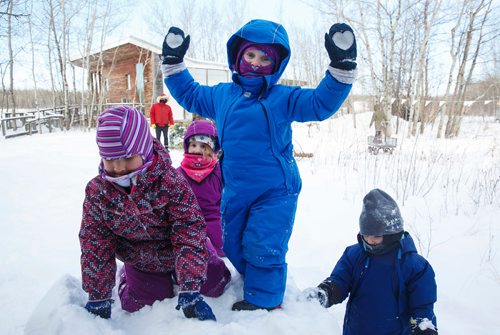 MIKE DEAL / WINNIPEG FREE PRESS
(From left) Bailey, 4, Tessa, 4, Josie, 4, and Neyla, 3, love playing in the snow during self-directed play outdoors Monday morning at the FortWhyte Alive Forest School.
A pre-school alternative where kids ages 3-5 spend the whole session outdoors in the woods, even in this cold weather. They are hardier than most adults! 
190128 - Monday, January 28, 2019.