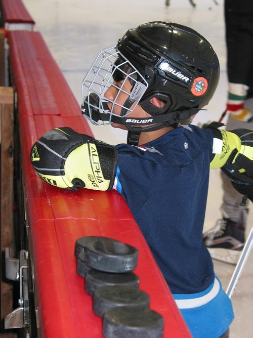 Canstar Community News Jan. 13, 2019 - A young hockey player takes a break while at Camp Manitou on Jan. 13 as part of a group of newcomers to Canada who were at the camp to experience some typical Manitoba winter activities. (ANDREA GEARY/CANSTAR COMMUNITY NEWS)