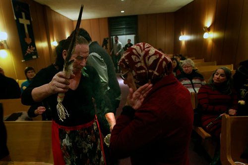 PHIL HOSSACK / WINNIPEG FREE PRESS - Local Muslim spokeswoman Shahina Siddique of the National Council of Canadian Muslims takes a smudge offered at a Tuesday evening Memorial for six men shot and killed at a Montreal Mosque in 2017. - January 29, 2019. 

"On January 29th, 2017 six men were shot and killed while nineteen were injured, some permanently, as they practiced their faith through evening prayers.  This is by far the deadliest example of Islamophobia in Canada but by no means the only one.  Statistics Canada reported last December that crimes targeting Muslims accounted for almost 1 in 5 of all reported hate crimes in Canada.  On January 10th, 2019, a man felt emboldened enough to state at an open, televised town hall meeting with the Prime Minister of Canada that our open border was allowing the tyranny coming down on us that he  went on to identify as Islam. 

Here in Winnipeg, we have our share of racism and intolerance.  As residents of Treaty 1 Territory, the traditional territory of the Anishinaabeg, Cree, OjiCree, Dakota, Dene peoples and the homeland of the Metis Nation, we acknowledge that they were the first recipients of discrimination, racism and oppression on this land.  Unfortunately, the racism they face, continues to today.   

Our goal for this Day of Remembrance is to stand in solidarity with everyone who understands that if one group of Canadians due to their race or religion can be labelled as the other, lesser or worse to be feared, then any group of people can be labelled as such, and consequently marginalized.

We invite all Winnipeggers to join us in taking the time to pause, reflect, and reiterate our commitment to unity and solidarity against all hate-fueled and bigoted actions that would seek to divide us."