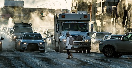 PHIL HOSSACK / WINNIPEG MANITOBA - Weather - Wreathed in exhaust fog pedestrians and traffic at Portage and Maryland dealt with the -30C temperatures on the evening commute home.. See story. January 30, 2019