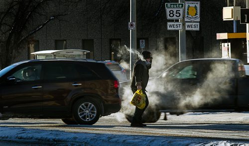 PHIL HOSSACK / WINNIPEG MANITOBA - Weather - Wreathed in exhaust fog pedestrians and traffic at Portage and Maryland dealt with the -30C temperatures on the evening commute home.. See story. January 30, 2019
