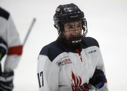 TREVOR HAGAN / WINNIPEG FREE PRESS
St.Mary's Academy Flames' Alexis Woodward, age 15, smiles after defeating her older sister, Taylor Woodward, age 18, and snubbing her in the handshake line during the Female World Sport School Challenge hockey tournament at the Iceplex, Thursday, January 31, 2019.