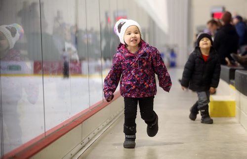 TREVOR HAGAN / WINNIPEG FREE PRESS
Rowan Umpherville, 4, playing next to the rink while supporting her sister Carrigan who plays for the Pilot Mound Buffaloes, during the Female World Sport School Challenge hockey tournament at the Iceplex, Thursday, January 31, 2019.