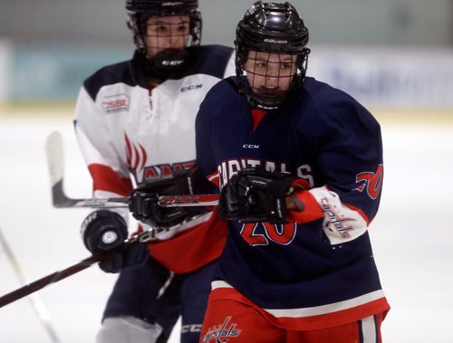 TREVOR HAGAN / WINNIPEG FREE PRESS
Sisters, Central Plains Capitals, Taylor Woodward, age 18, right, and St.Mary's Academy Flames' Alexis Woodward, age 15, during the Female World Sport School Challenge hockey tournament at the Iceplex, Thursday, January 31, 2019. It was the first time they have played each other.