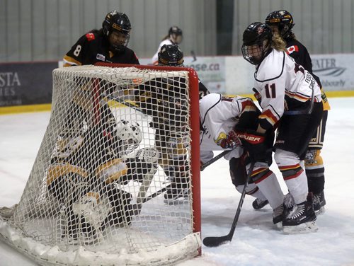 TREVOR HAGAN / WINNIPEG FREE PRESS
Pilot Mound Buffaloes goaltender Hana Bush is pushed into the net while playing against the Lloydminster PMW Steelers, during the Female World Sport School Challenge hockey tournament at the Iceplex, Thursday, January 31, 2019.