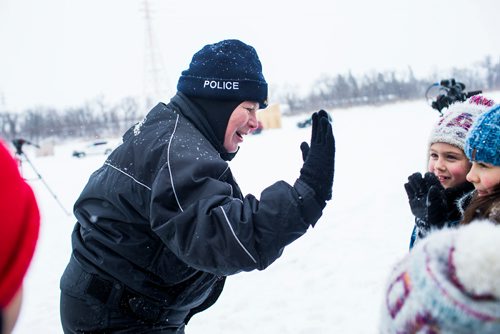 MIKAELA MACKENZIE / WINNIPEG FREE PRESS
RCMP commissioner Brenda Lucki  high-fives kids while visiting ice shacks on the Red River near Selkirk, Manitoba on Friday, Feb. 1, 2019.
Winnipeg Free Press 2018.