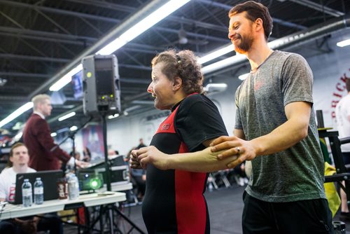 MIKAELA MACKENZIE / WINNIPEG FREE PRESS
Tammy Hardt, part of the Bar-Benders Special Olympics team, walks out with her coach, Brent Lohmer, after doing her bench press at Brickhouse Gyms fourth annual powerlifting competition, Manitoba's largest powerlifting competition to date, in Winnipeg on Saturday, Feb. 2, 2019.
Winnipeg Free Press 2018.