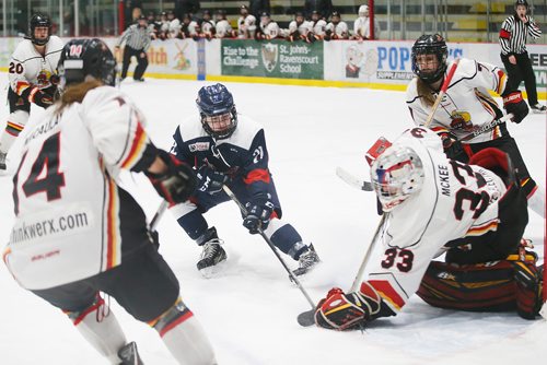JOHN WOODS / WINNIPEG FREE PRESS
St Mary's Academy's Jessica Haner (22) rushes the Lloydminster PMW Steelers' goaltender Bella McKee (33) in first period of the gold medal game at the Female World Sport School Challenge at Iceplex in Winnipeg Sunday, February 3, 2019.