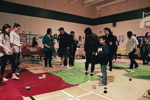 Canstar Community News People held objects that represent their role in Indigenous society during the blanket exercise at Walk a Mile in our Moccasins: Truth and Reconciliation Training at Collicutt School on April 4, 2017.