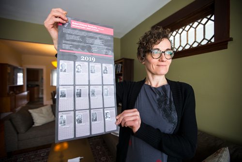 MIKAELA MACKENZIE / WINNIPEG FREE PRESS
English professor Heather Milne poses with the all-male "notable Canadians" calendar that liberal MP Robert-Falcon Ouellette sent out in Winnipeg on Wednesday, Feb. 6, 2019. 
Winnipeg Free Press 2019.