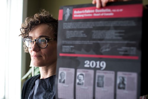 MIKAELA MACKENZIE / WINNIPEG FREE PRESS
English professor Heather Milne poses with the all-male "notable Canadians" calendar that liberal MP Robert-Falcon Ouellette sent out in Winnipeg on Wednesday, Feb. 6, 2019. 
Winnipeg Free Press 2019.