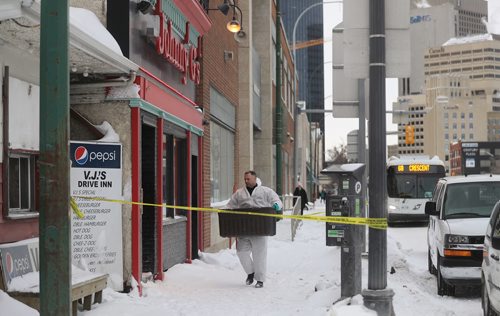 TREVOR HAGAN/ WINNIPEG PRESS
A member of the WPS's forensic investigation unit at the scene of a double homicide at Johnny G's on Main Street, Wednesday, February 6, 2019.