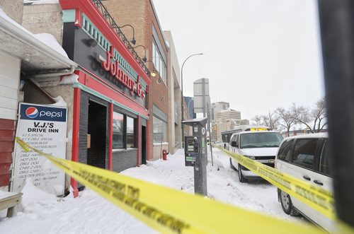 TREVOR HAGAN/ WINNIPEG PRESS
The WPS's forensic investigation unit is at the scene of a double homicide at Johnny G's on Main Street, Wednesday, February 6, 2019.