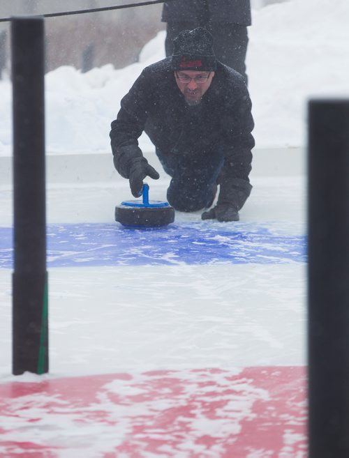 MIKE DEAL / WINNIPEG FREE PRESS
The Second Annual International Crokicurl Tournaspiel took place despite the blowing snow at The Forks with Winnipegs Mayor Brian Bowman, Winklers Mayor Martin Harder, and Steinbachs Mayor Erik Funk battling it out for The Mayors Cup Thursday morning.
Mayor Funk throws a rock during a game against Winklers Mayor Martin Harder.
190207 - Thursday, February 07, 2019.