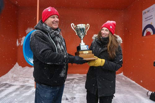 MIKE DEAL / WINNIPEG FREE PRESS
The Second Annual International Crokicurl Tournaspiel took place despite the blowing snow at The Forks with Winnipegs Mayor Brian Bowman, Winklers Mayor Martin Harder, and Steinbachs Mayor Erik Funk battling it out for The Mayors Cup Thursday morning.
Winklers Mayor Martin Harder accepts The Mayor's Cup from one of crokicurl's creators, Liz Wreford, after winning the Tournaspiel.
190207 - Thursday, February 07, 2019.