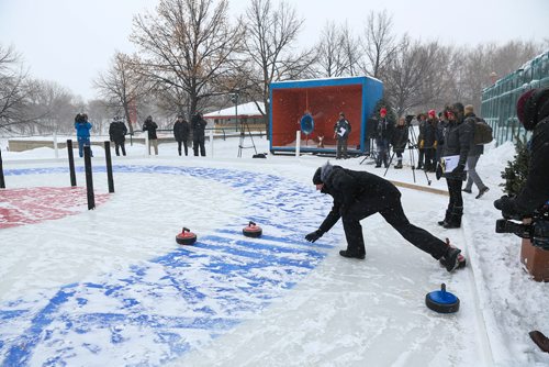 MIKE DEAL / WINNIPEG FREE PRESS
The Second Annual International Crokicurl Tournaspiel took place despite the blowing snow at The Forks with Winnipegs Mayor Brian Bowman, Winklers Mayor Martin Harder, and Steinbachs Mayor Erik Funk battling it out for The Mayors Cup Thursday morning.
Mayor Bowman throws a rock during a game against Steinbach's Mayor Erik Funk.
190207 - Thursday, February 07, 2019.