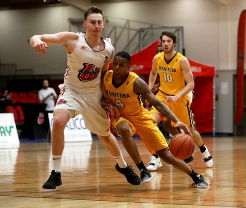 TREVOR HAGAN / WINNIPEG FREE PRESS 
Winnipeg Wesmen Billy Yaworksy (7) guarding Manitoba Bisons' guard Rashawn Browne (4) during a single game elimination, Wednesday, February 6, 2019.