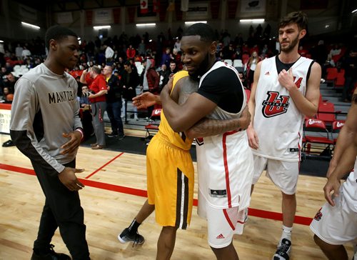 TREVOR HAGAN / WINNIPEG FREE PRESS 
Manitoba Bisons' guard Rashawn Browne (4) congratulates Winnipeg Wesmen Narcisse Ambanza (3) after a single game elimination, Wednesday, February 6, 2019.