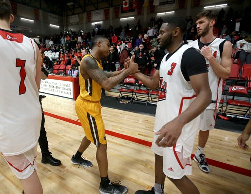 TREVOR HAGAN / WINNIPEG FREE PRESS 
Manitoba Bisons' guard Rashawn Browne (4) congratulates Winnipeg Wesmen Narcisse Ambanza (3) after a single game elimination, Wednesday, February 6, 2019.