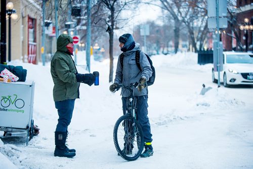 MIKAELA MACKENZIE / WINNIPEG FREE PRESS
Mark Cohoe, executive director of Bike Winnipeg, talks to cyclist Jordan H. at a winter bike to work day pit stop, where cyclists can stop and enjoy a hot coffee on their way to work at Bannatyne and Rorie in Winnipeg on Friday, Feb. 8, 2019.
Winnipeg Free Press 2019.