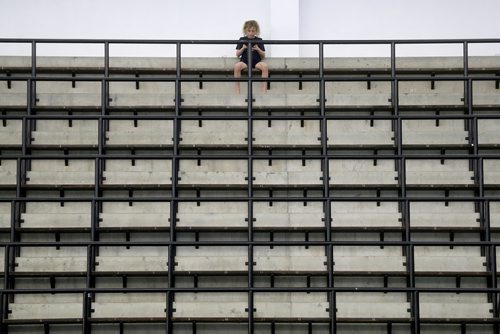 TREVOR HAGAN / WINNIPEG FREE PRESS
Kash Tarasoff from the Saskatoon Diving Club, playing on a phone while waiting between events at Pan Am Pool during the 2010 Polar Bear Classic, Friday, February 8, 2019.