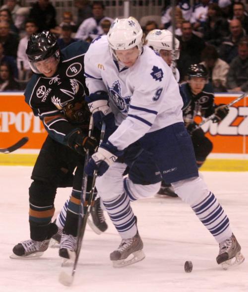 The Manitoba Moose`s Jason Krog and the Toronto Marlies` Josh Engel battle for the puck during the first period of AHL playoff action at the Ricoh Centre in Toronto, ON Sunday, April 19, 2009. Darren Calabrese for The Winnipeg Free Press