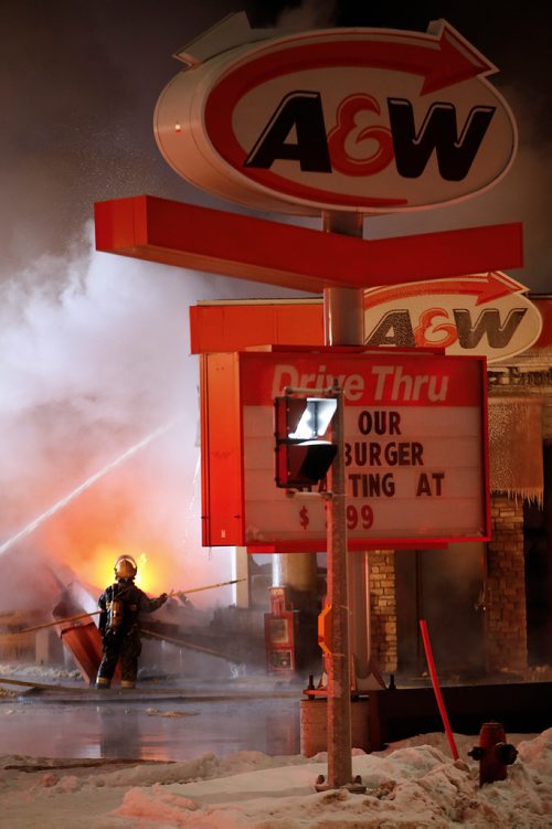 JOHN WOODS / WINNIPEG FREE PRESS
Fire-fighters work to extinguish a fire at a local restaurant on Main Street at Inkster in Winnipeg Sunday, February 10, 2019.