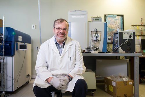 MIKAELA MACKENZIE / WINNIPEG FREE PRESS
Professor of medical microbiology at the University of Manitoba Kevin Coombs poses by a mass spectrometer in his lab, where he researches viruses and influenza, at the John Buhler Research Centre in Winnipeg on Monday, Feb. 11, 2019. The mass spectrometers were used to analyze proteins while he was researching the Spanish Flu.
Winnipeg Free Press 2019.