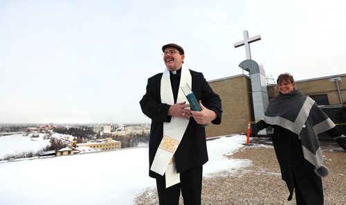 RUTH BONNEVILLE / WINNIPEG FREE PRESS

Standup - ST.B Cross blessing

Archbishop Albert LeGatt blessing the new LED rooftop cross that replaced the one from 1953, with scenes of the downtown surrounding them. 

Also in attendance with the Archbishop is Martine Bouchard, St. Boniface Hospital President and CEO along with engineering staff and St. B in-house media capturing the event Monday. 

Standup 

Feb 11, 2019
