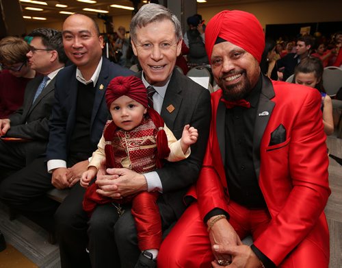 JASON HALSTEAD / WINNIPEG FREE PRESS

L-R: Jon Reyes (MLA for St. Norbert), Terry Duguid (Member of Parliament for Winnipeg South) and Paul Dhillon (President, Dhillon Automotive Group) with Dhillon's 16-month-old grandson Juliano at the Lohri Mela celebration at the RBC Convention Centre Winnipeg on Jan. 12, 2019. (See Social Page)
