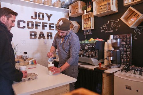 MIKE DEAL / WINNIPEG FREE PRESS
Alex Meron Gamili owner of Joy Coffee Bar 3311c Roblin Blvd prepares a coffee for a customer Tuesday morning. 
190212 - Tuesday, February 2, 2019
