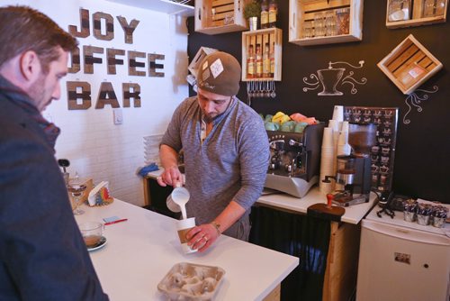 MIKE DEAL / WINNIPEG FREE PRESS
Alex Meron Gamili owner of Joy Coffee Bar 3311c Roblin Blvd prepares a coffee for a customer Tuesday morning. 
190212 - Tuesday, February 2, 2019