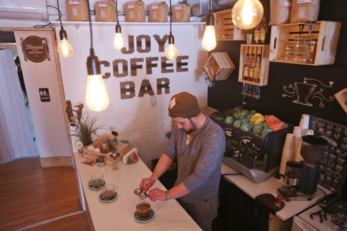 MIKE DEAL / WINNIPEG FREE PRESS
Alex Meron Gamili owner of Joy Coffee Bar 3311c Roblin Blvd prepares a coffee for a customer Tuesday morning. 
190212 - Tuesday, February 2, 2019