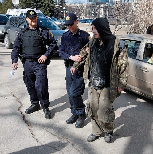 BORIS MINKEVICH / WINNIPEG FREE PRESS  090420 4:20 at the Leg. Police help an impared person who was caught crawling down the road.