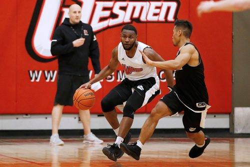 JOHN WOODS / WINNIPEG FREE PRESS
The University of Winnipeg Wesmen's Narcisse Ambanza practices with his team at the University of Winnipeg as head coach Mike Raimbault looks on Tuesday, February 12, 2019. The Wesmen teams have advanced to the second round of the Canada West conference playoffs.

