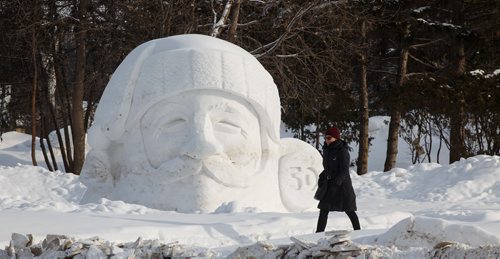 MIKE DEAL / WINNIPEG FREE PRESS
A person walks past a snow sculpture in front of the Manitoba Legislative building Tuesday afternoon.
190212 - Tuesday, February 12, 2019.