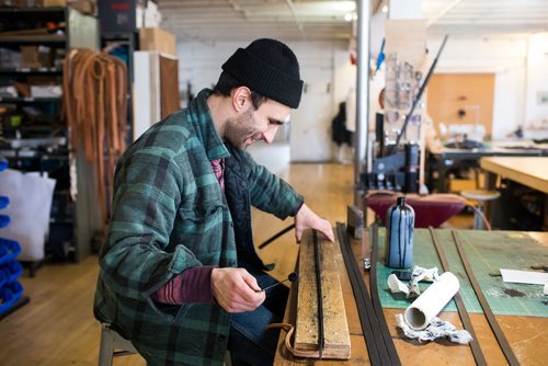 MIKAELA MACKENZIE / WINNIPEG FREE PRESS
Co-owner of Wilder Goods, Brendon Friesen, works in his retail and workshop space in the exchange district in Winnipeg on Friday, Feb. 8, 2019.
Winnipeg Free Press 2019.