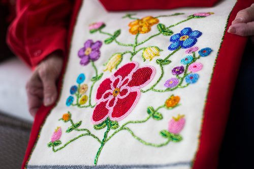 MIKAELA MACKENZIE / WINNIPEG FREE PRESS
Lucienne Beaudry Loiselle, who has been a volunteer at Festival du Voyageur since 1969, poses for a portrait in costume in Winnipeg on Wednesday, Feb. 13, 2019. The beading on her bag represents her family members.
Winnipeg Free Press 2019.