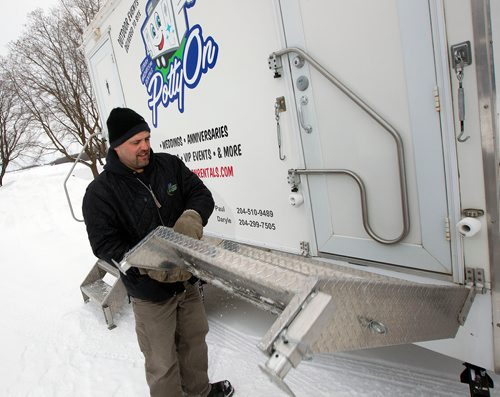 PHIL HOSSACK / WINNIPEG FREE PRESS - Paul Levreault  lowers the stairway into his  "Potty-On", a portable potty service for upscale events. The potty is actually a trailer with running water, etc. See Bill Redekop's story. February 13, 2019