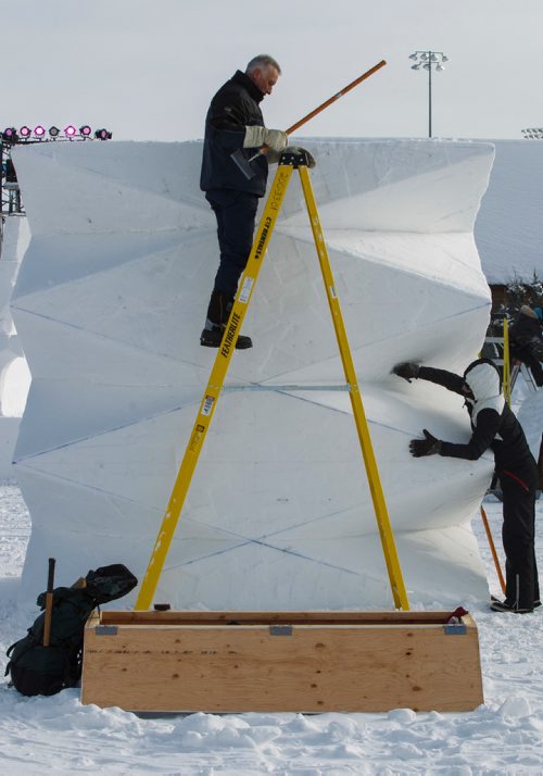 MIKE DEAL / WINNIPEG FREE PRESS
Jacques Boulet from Winnipeg climbs down a ladder after helping to clean off the top of Franziska Agrawals (right) sculpture Prisma which is part of the International Snow Sculpture Symposium at the Festival du Voyageur which kicks off today.
190214 - Thursday, February 14, 2019.