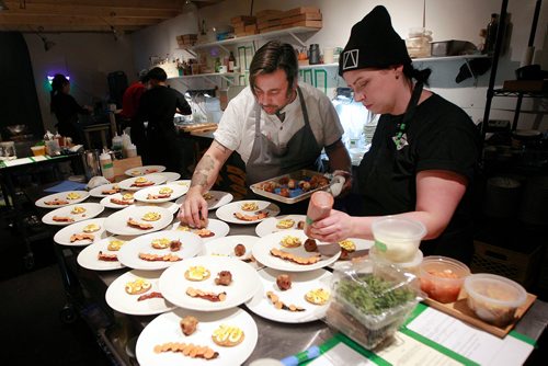 PHIL HOSSACK / WINNIPEG FREE PRESS - Raw Almond Maendel Hitzer co-founder and Chef Christine Sanford put the final touches on plates for the 530 sitting Valentines Day . See story. February 14, 2019.