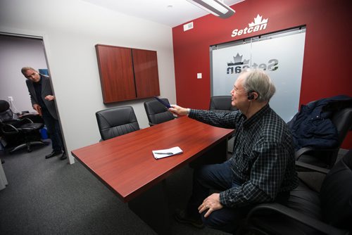 MIKAELA MACKENZIE / WINNIPEG FREE PRESS
Jeffrey Quail, CEO of Setcan (left), shows reporter Kevin Rollason the SimVoice technology at the Setcan offices in Winnipeg on Friday, Feb. 15, 2019.
Winnipeg Free Press 2019.