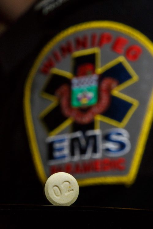 MIKE DEAL / WINNIPEG FREE PRESS
An olanzapine pill (meth pill) being held by a Winnipeg Fire Paramedic at Station #1.
190215 - Friday, February 15, 2019.