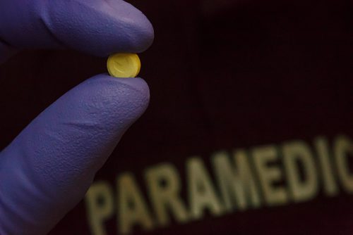 MIKE DEAL / WINNIPEG FREE PRESS
An olanzapine pill (meth pill) being held by a Winnipeg Fire Paramedic at Station #1.
190215 - Friday, February 15, 2019.